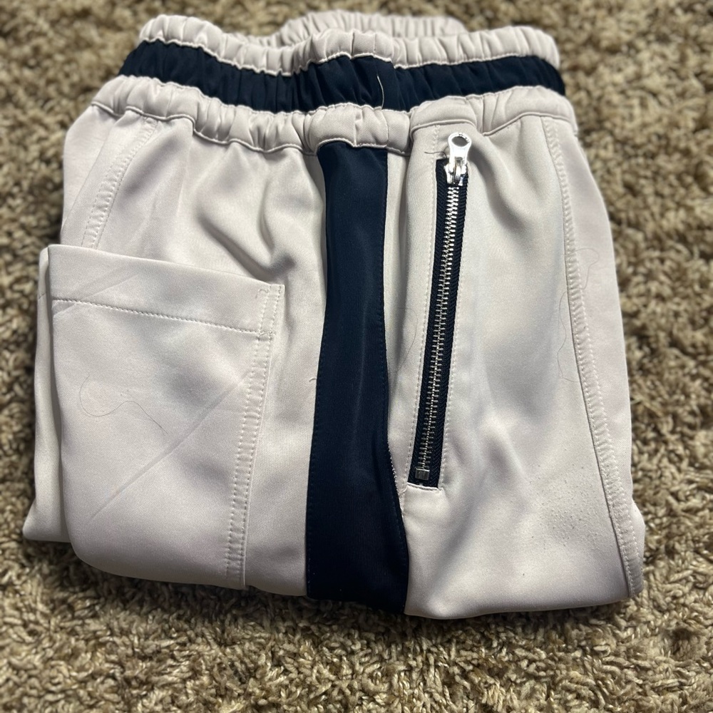 Size small “Crysp Denim” joggers pants with zipper at end.